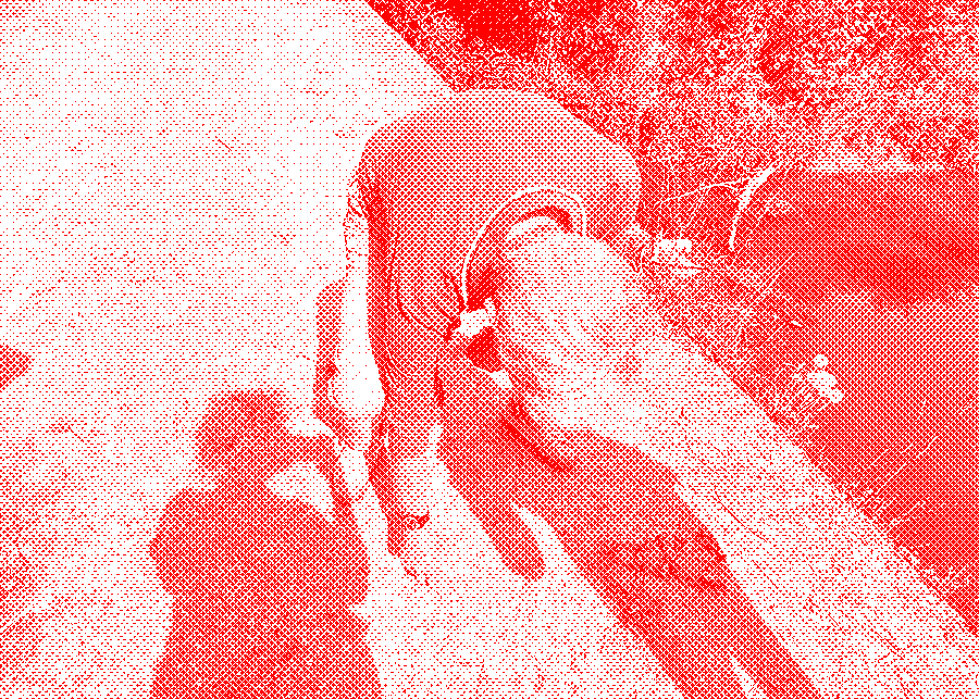 Man tracing the course of irrigation ditches in the dust beside a water channel.